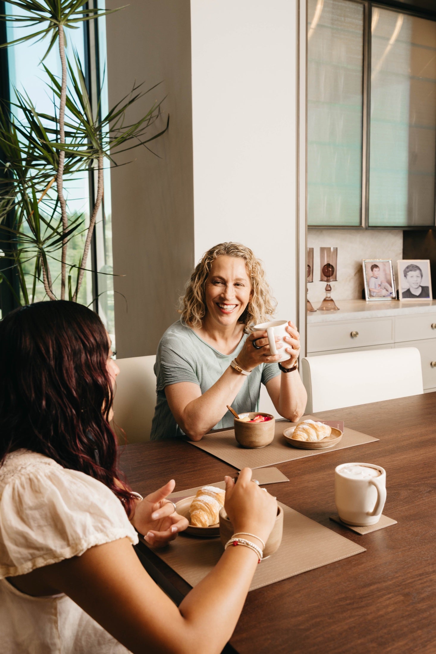 Two people sharing coffee with Goldilocks Ceramic Mugs