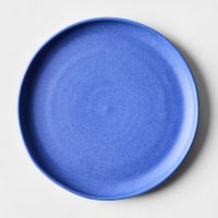 closeup of handmade cobalt blue ceramic plate with smooth finish