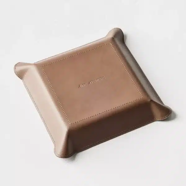 bottom view of leather catchall tray with embossed brand name