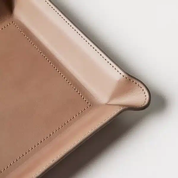 closeup of leather catchall tray stitching and corner details