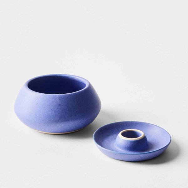 cobalt blue ceramic olive pit holder with a sleek, modern design and dedicated pit storage