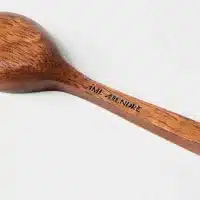 closeup of wooden serving spoon with brand name