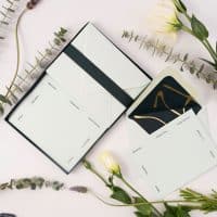 thank you letter writing set with multilingual note cards surrounded by greenery